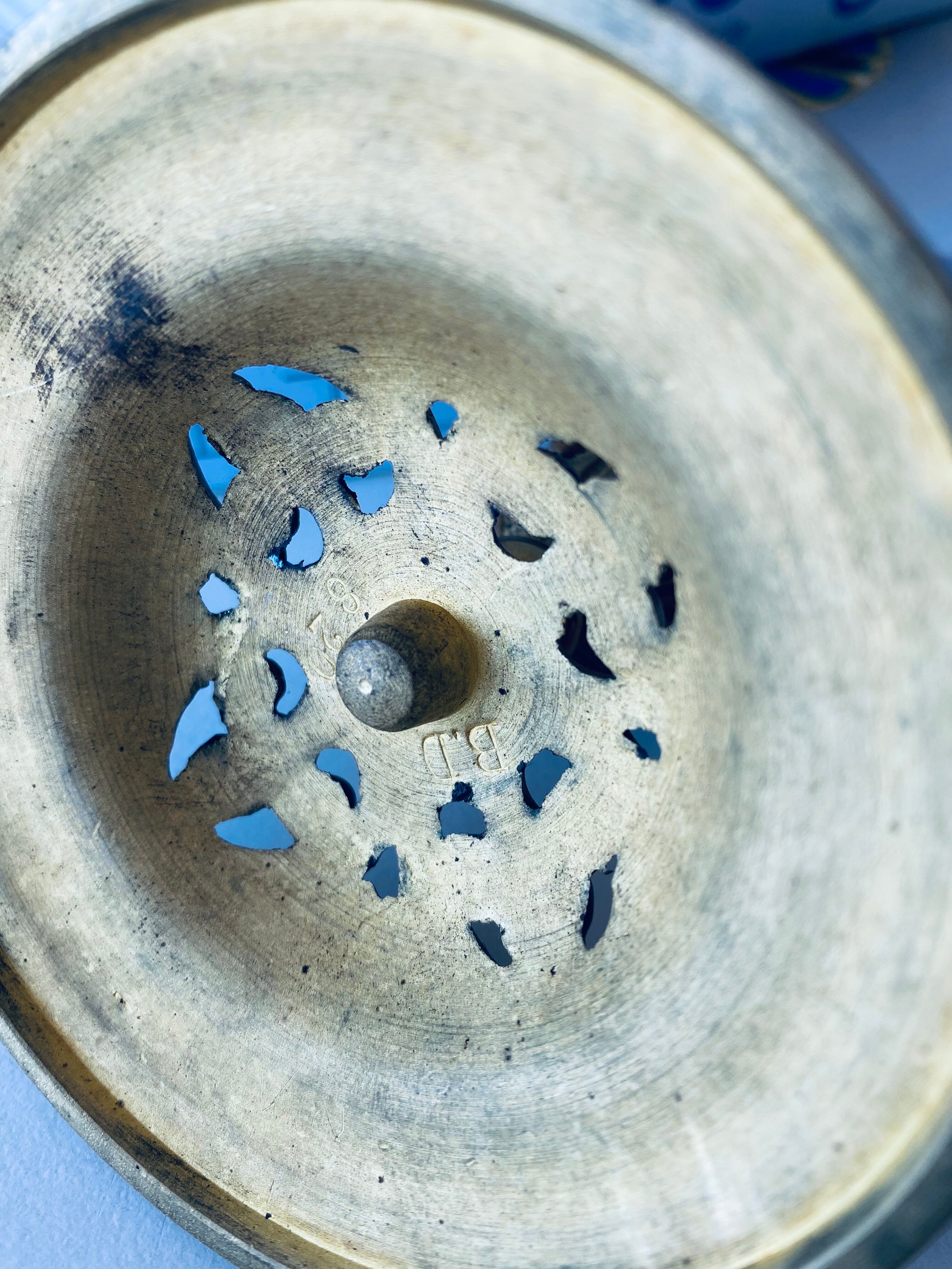 Pair of bronze candle holders signed