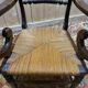 Pair of rustic straw-seated armchairs