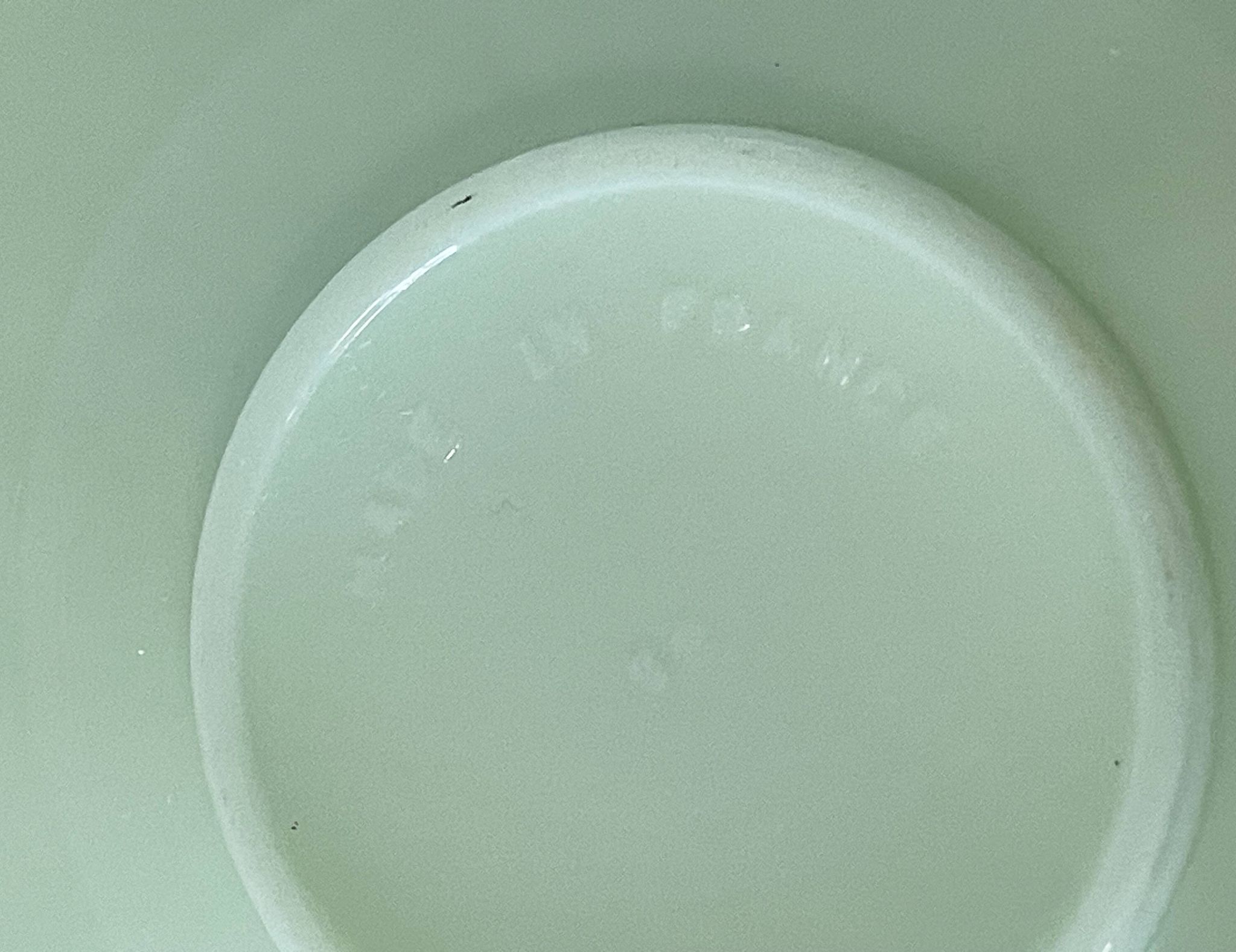 Set of 4 mint green opaline saucers with a swirl pattern, made in France.