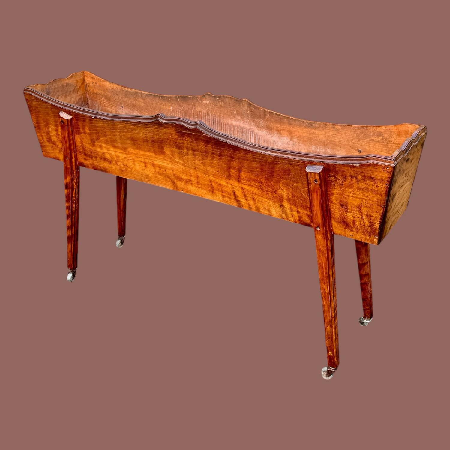 Old indoor planter on wheels