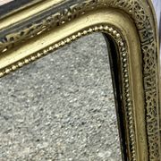 Miroir Louis Philippe en bois doré à frise ajourée