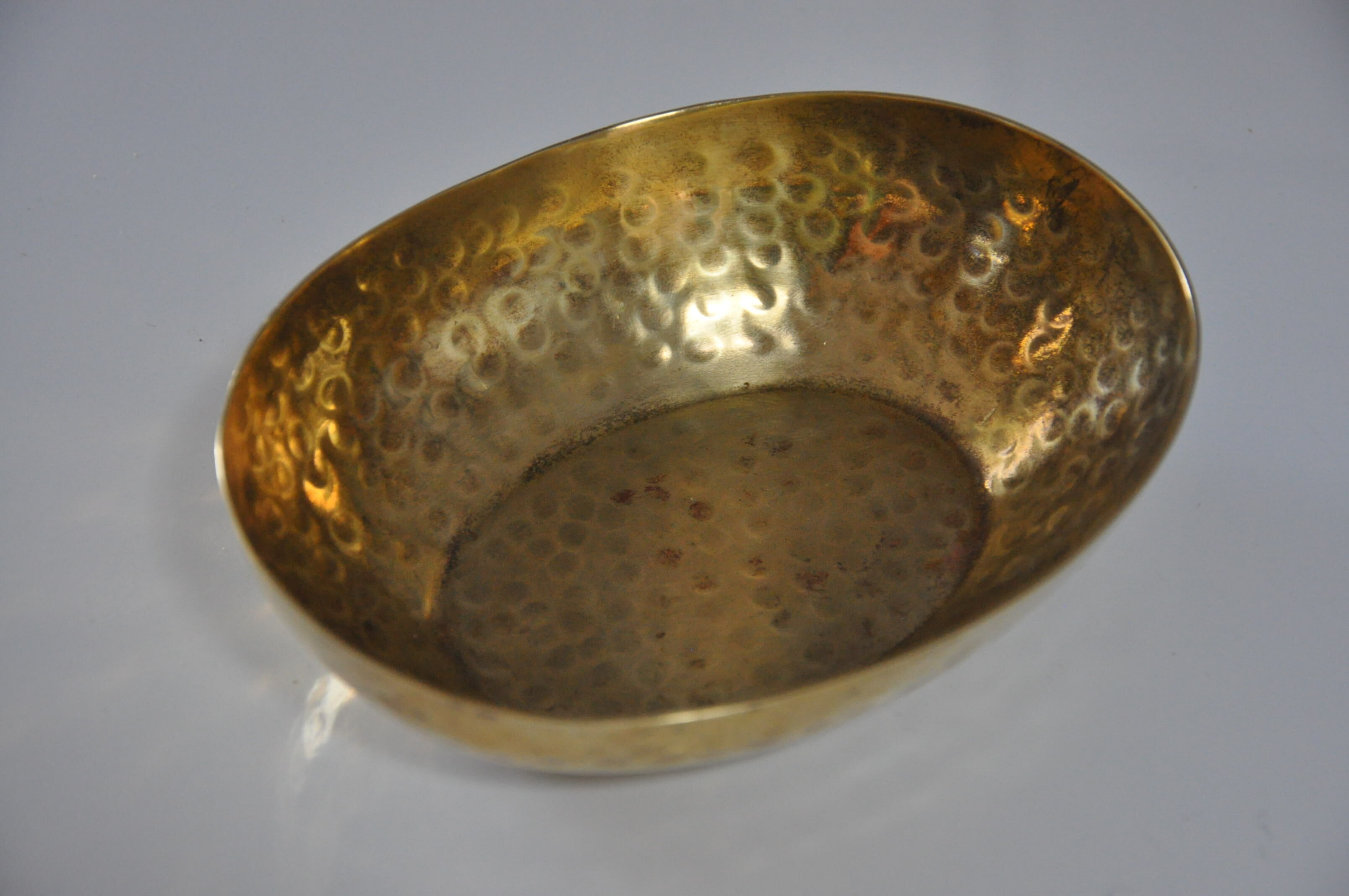 Empty hammered brass pocket