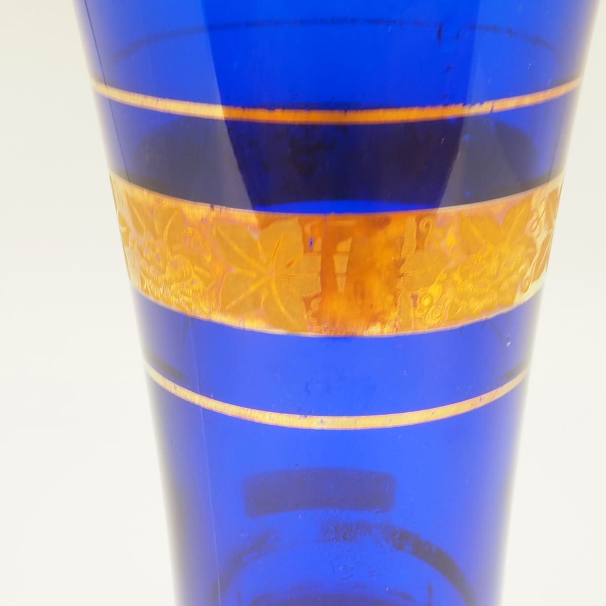 Blue glass decanter with gold decoration