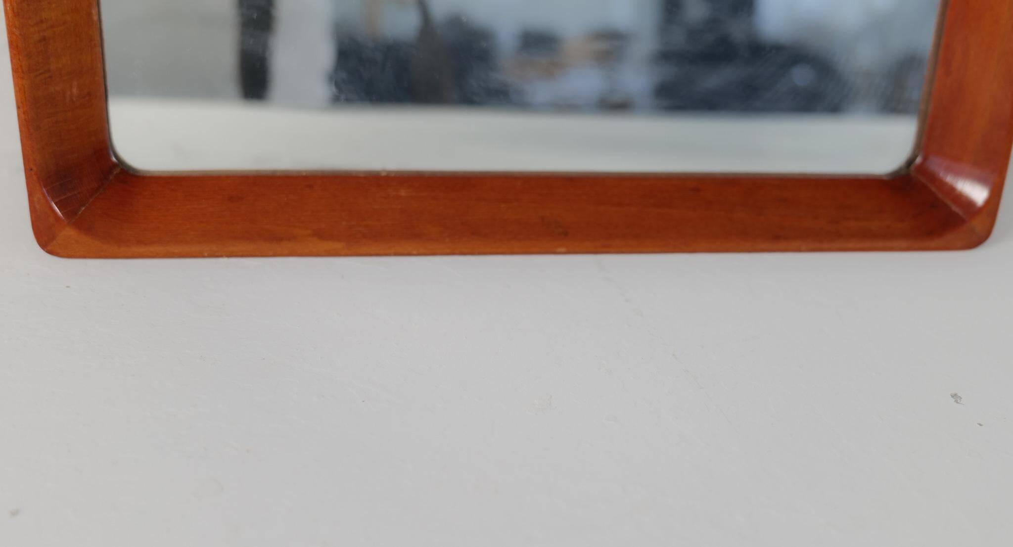 Modern Swedish mirror in mahogany from the 1940s.
