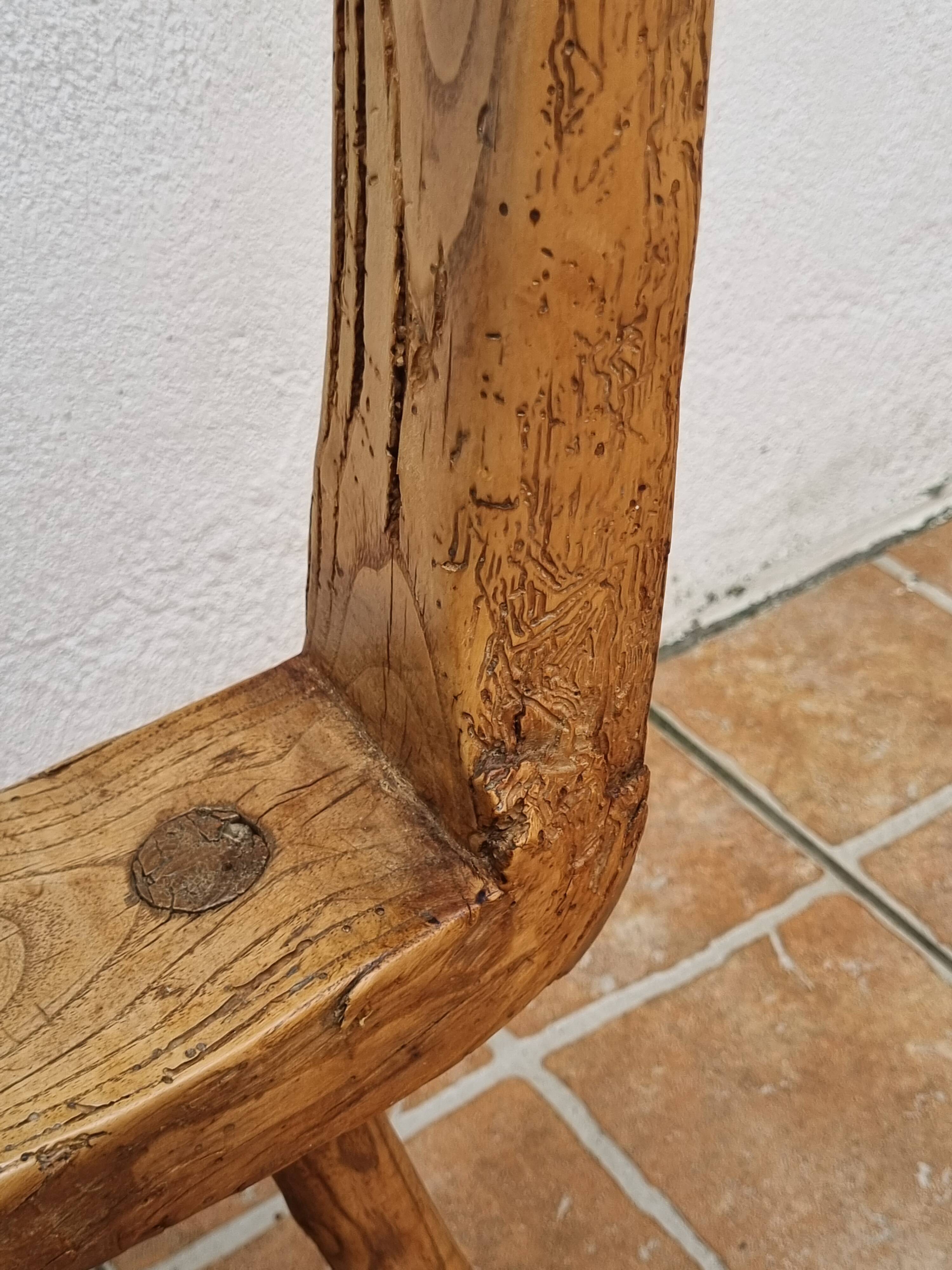 Brutalist chair in solid wood, European handcrafted work from the early 20th century.