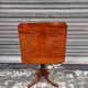 19th-century solid mahogany table with a tilting top and brass mechanism.
