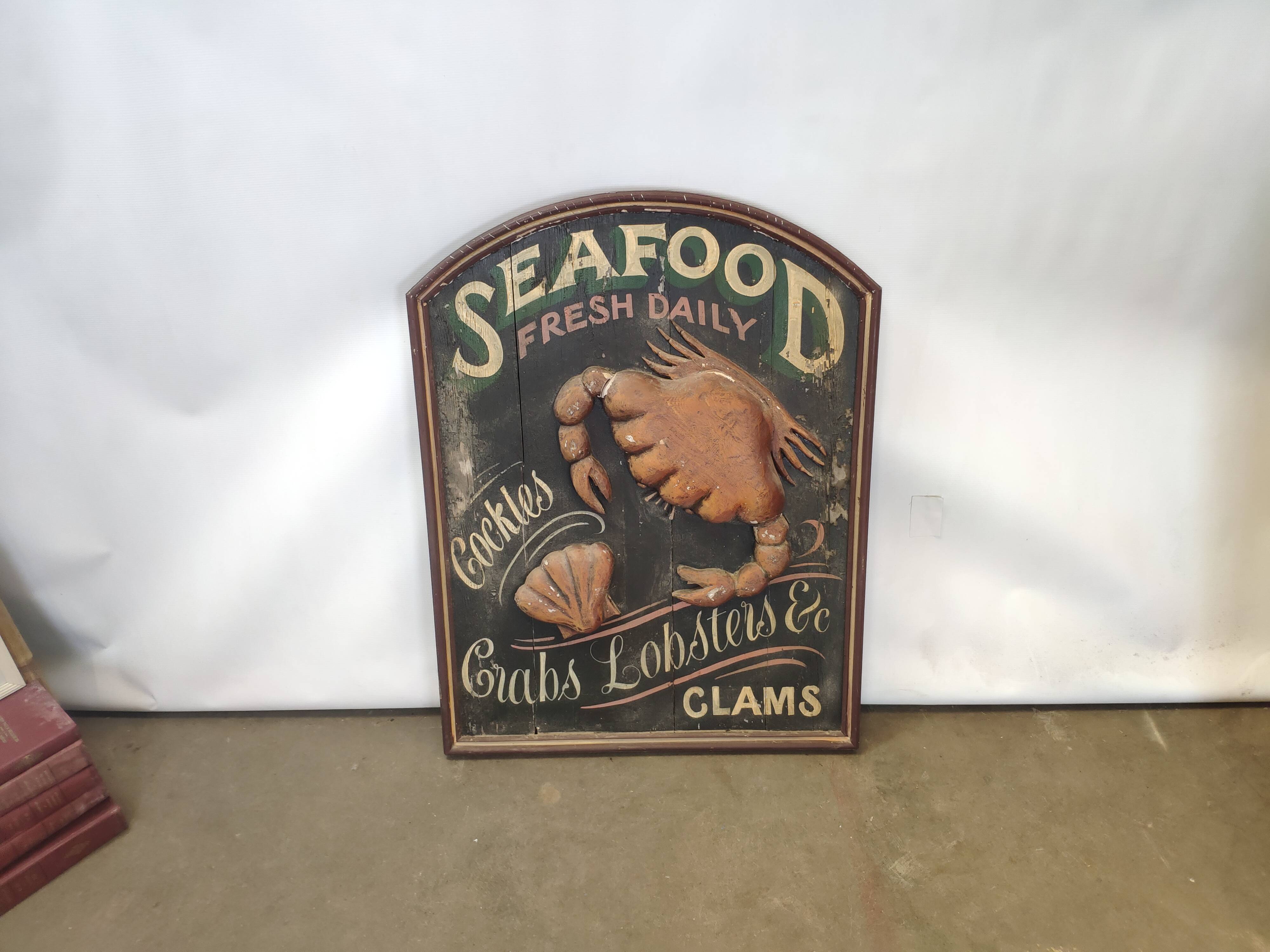 Former Seafood restaurant sign in rare relief