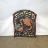 Former Seafood restaurant sign in rare relief
