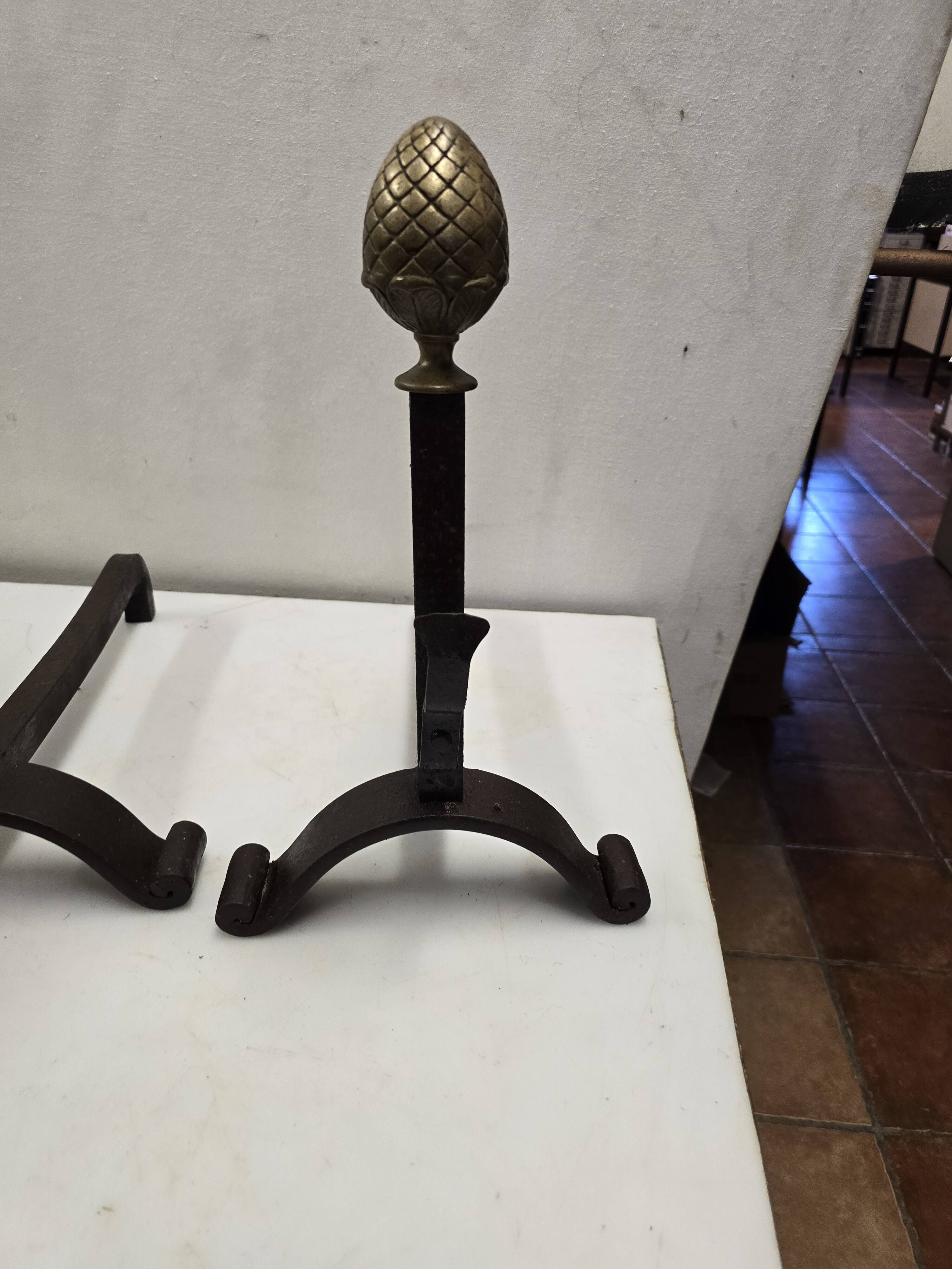 Old pair of wrought iron and bronze andirons