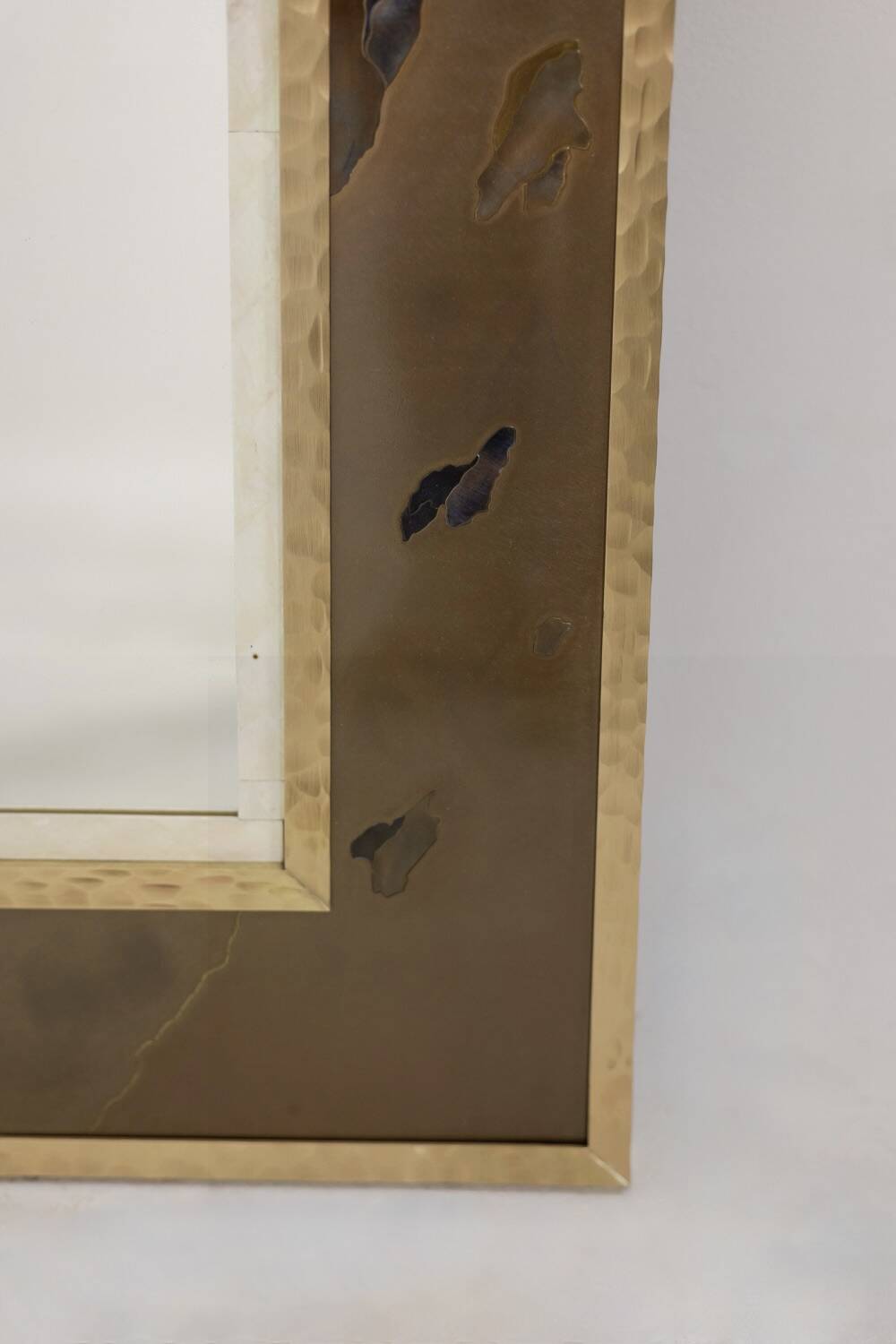 Mirror in marquetry of oxidised and patinated brass. Artist's work.