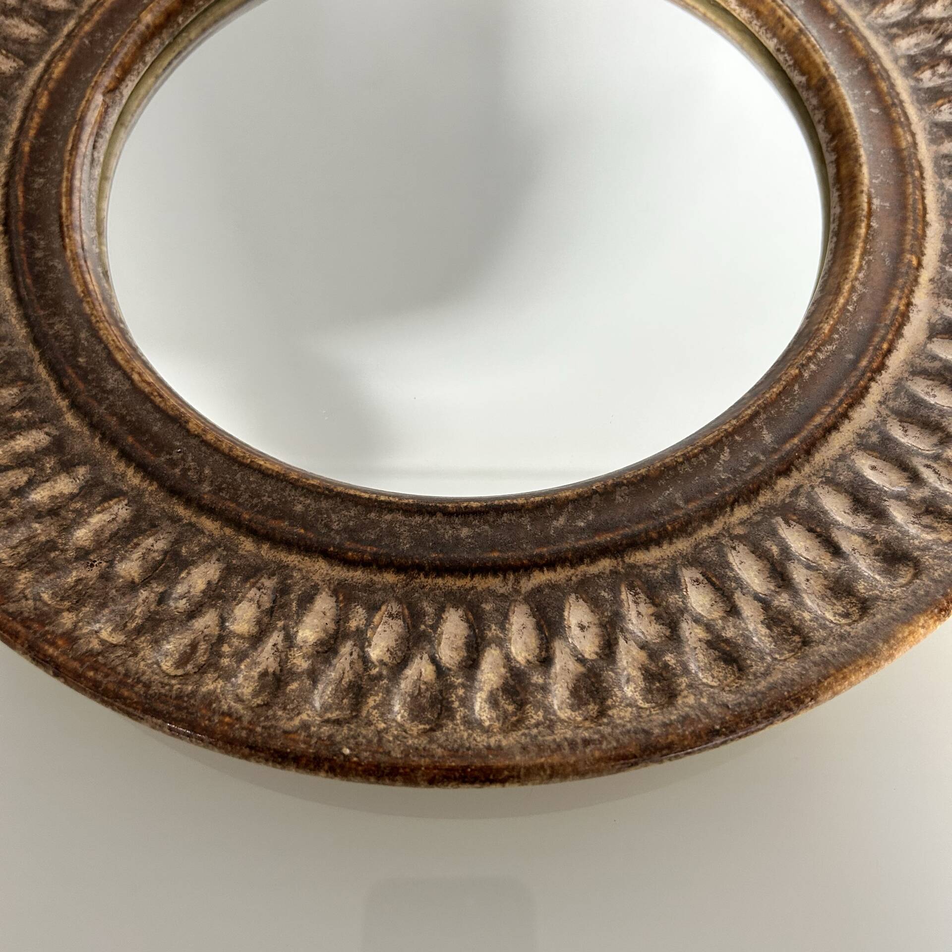 Chiselled stone mirror