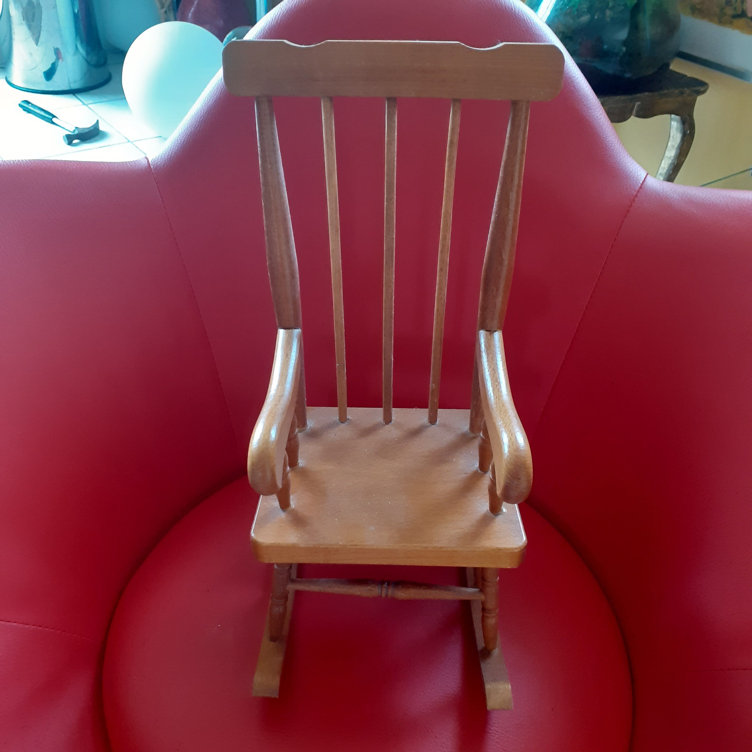 Toy wooden rocking chair.