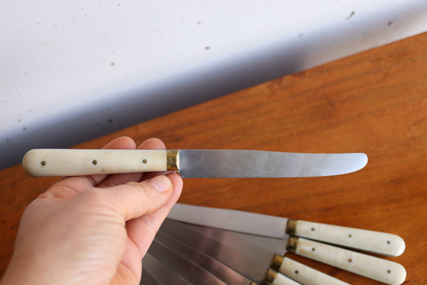 Set of 9 vintage cream table knives