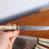 Set of 9 vintage cream table knives