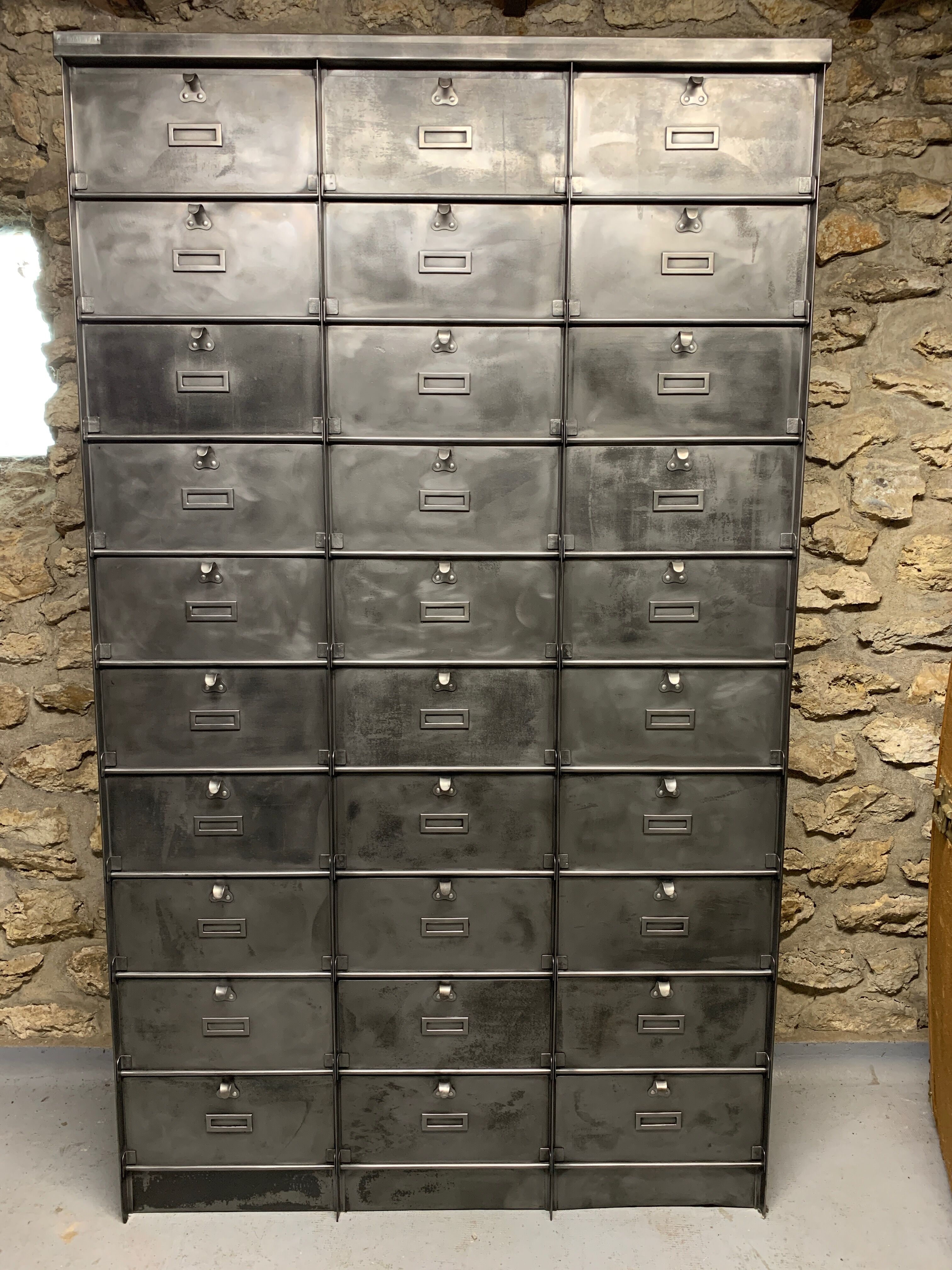 Industrial cladding furniture in brushed and patinated steel