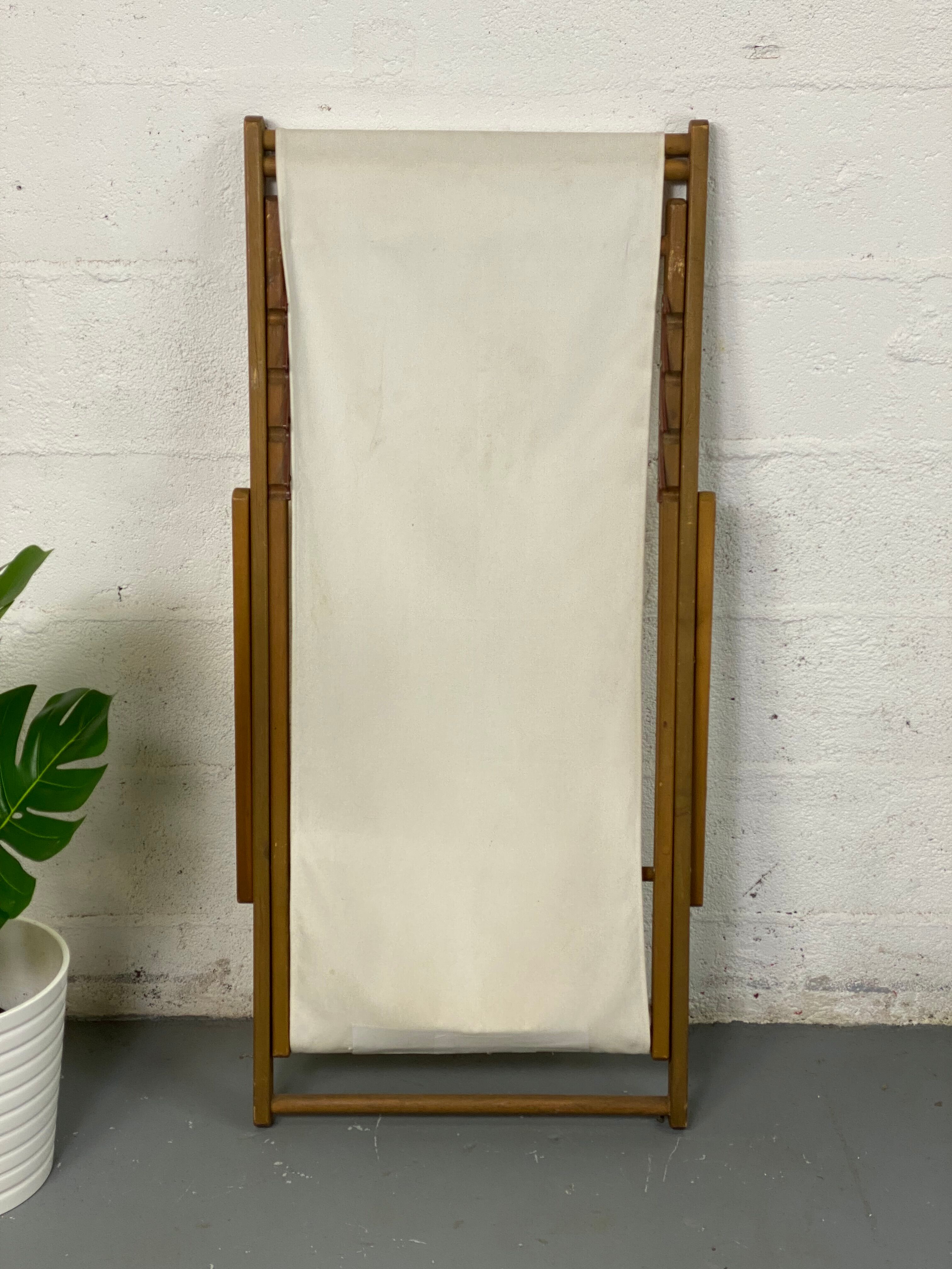 White fabric deckchair with wooden structure