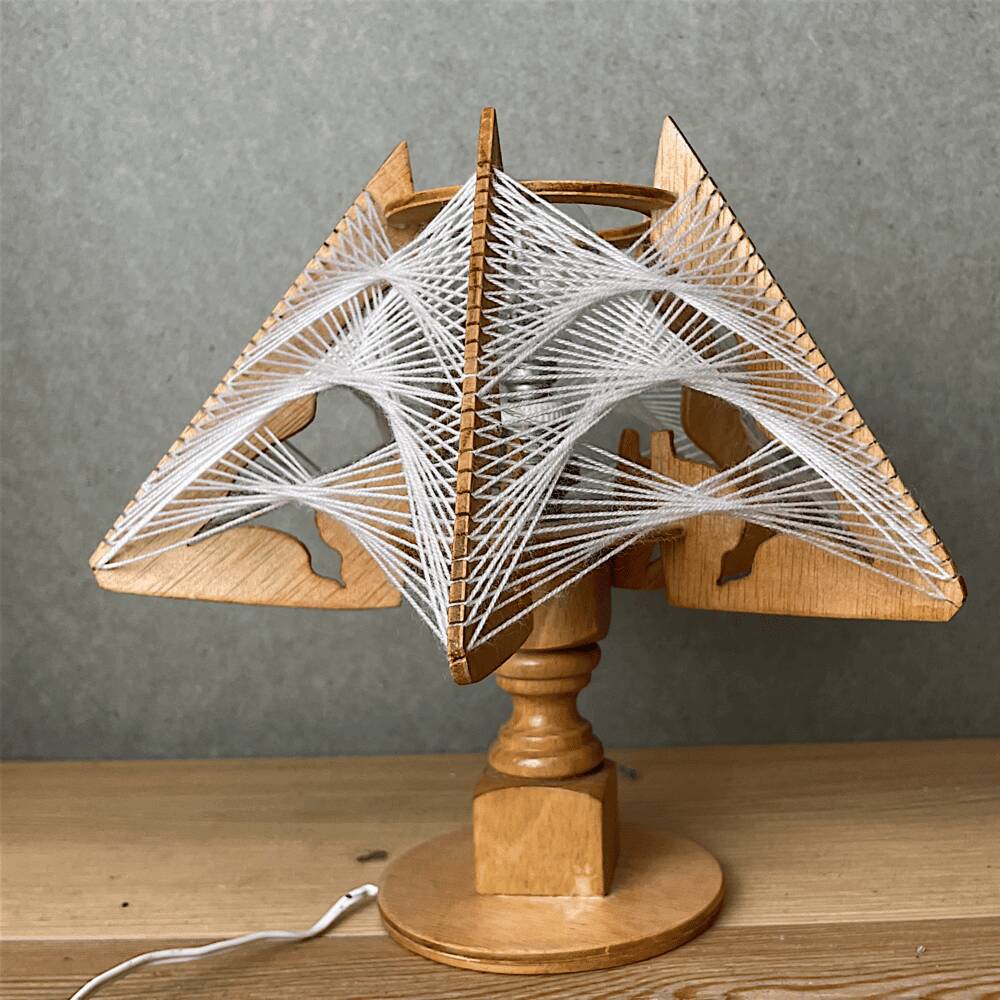 Geometric wood and string-art table lamp
