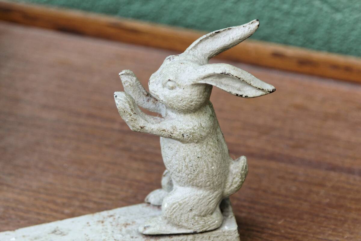 Old cast iron rabbit door wedge