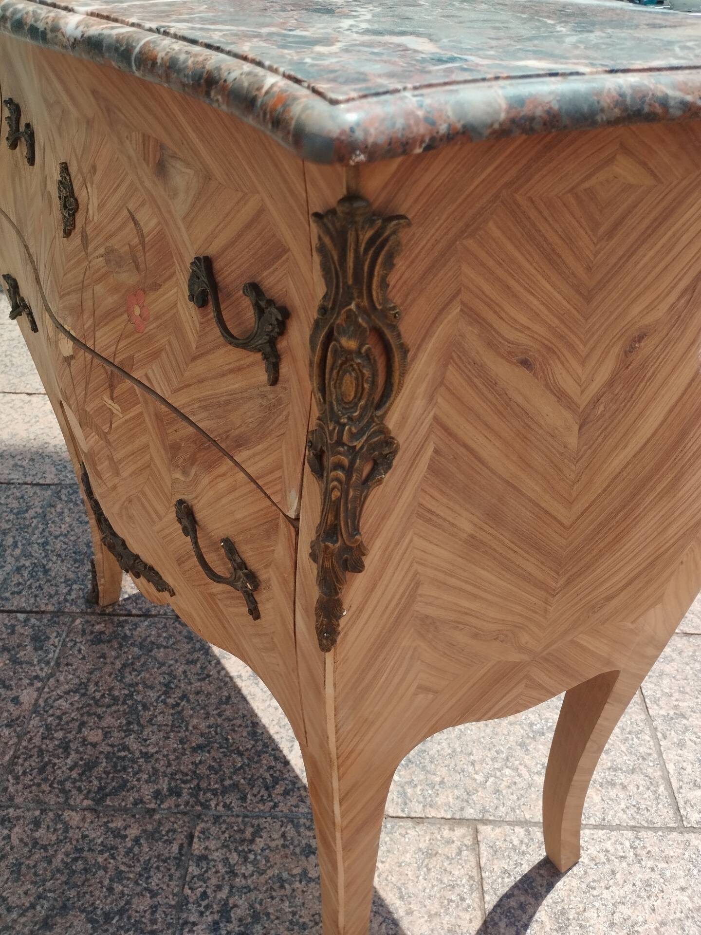 Antique commode in marquetry in the Louis XV style with a marble top.