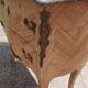 Antique commode in marquetry in the Louis XV style with a marble top.