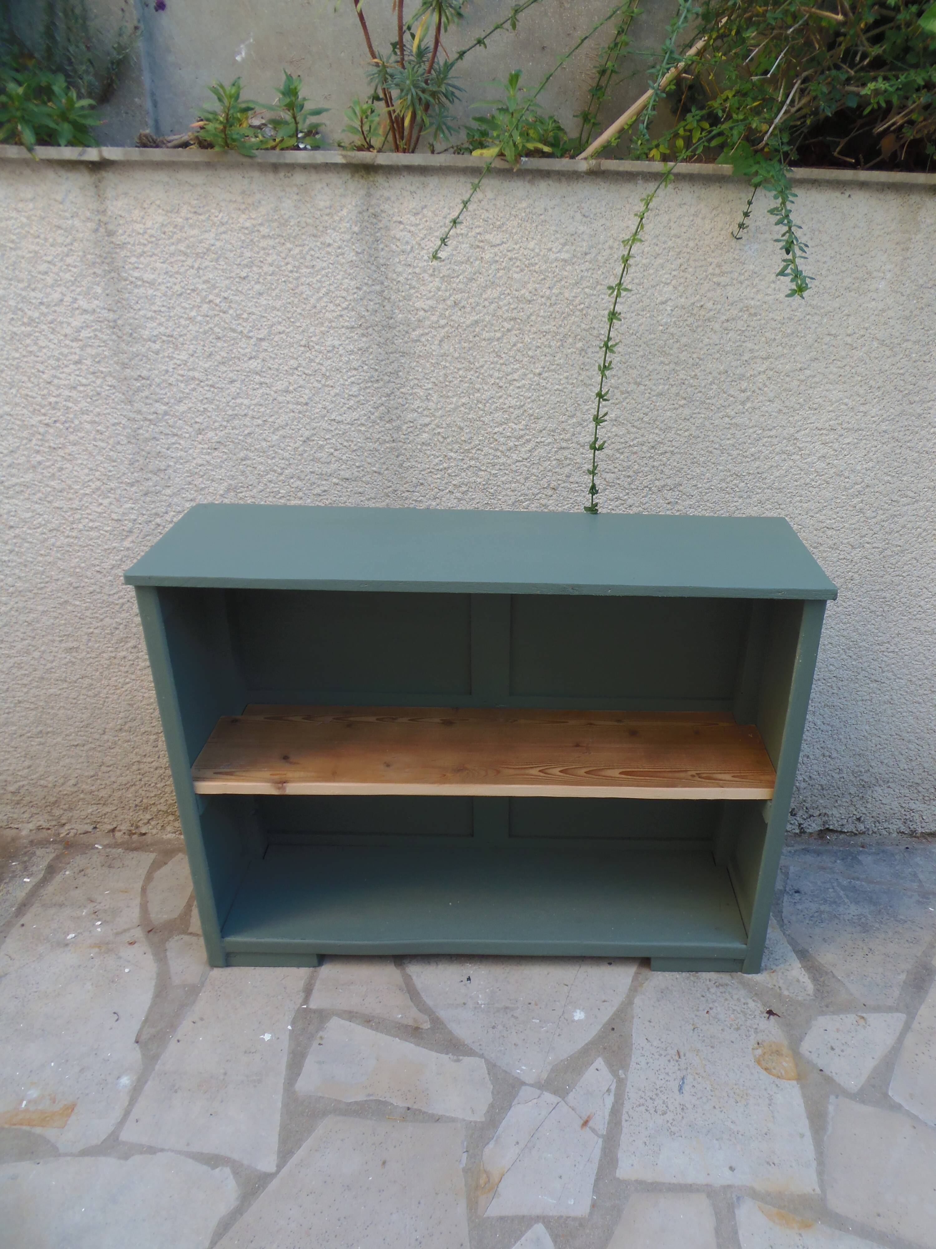 Vintage workshop furniture transformed into a re-enchanted bookshelf in smoky green.
