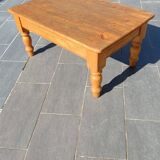 Solid oak coffee table with turned legs.