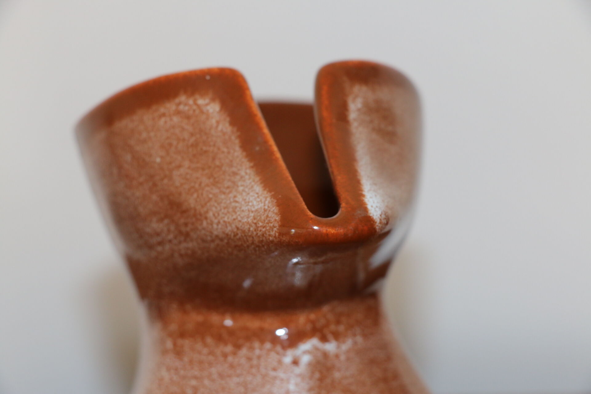 Brown painted earthenware pitcher