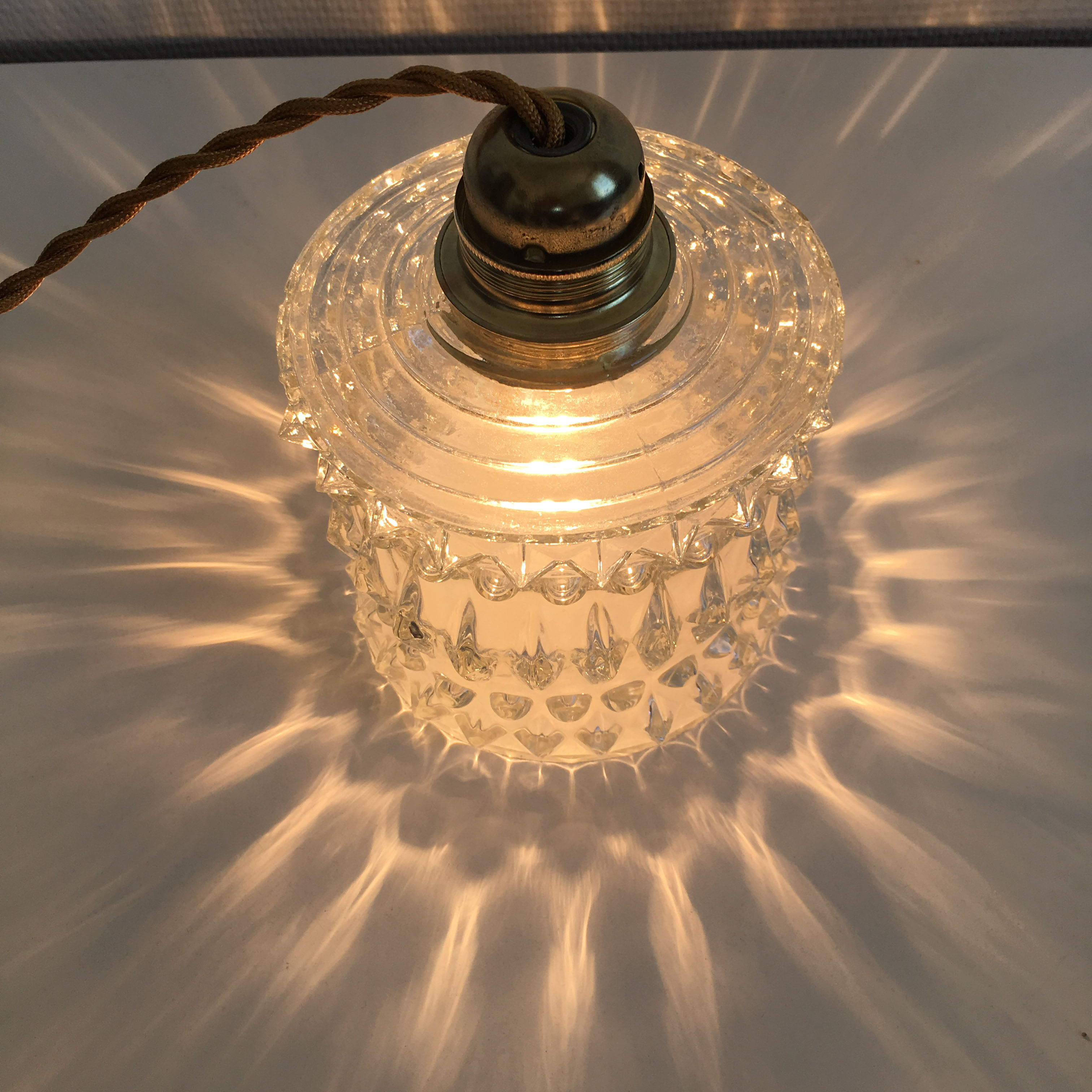 Suspension made with a vintage glass globe