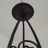 French Art Nouveau leaf detail iron three-light chandelier with amber glass shades.