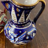Antique pinched pitchers in earthenware and slip