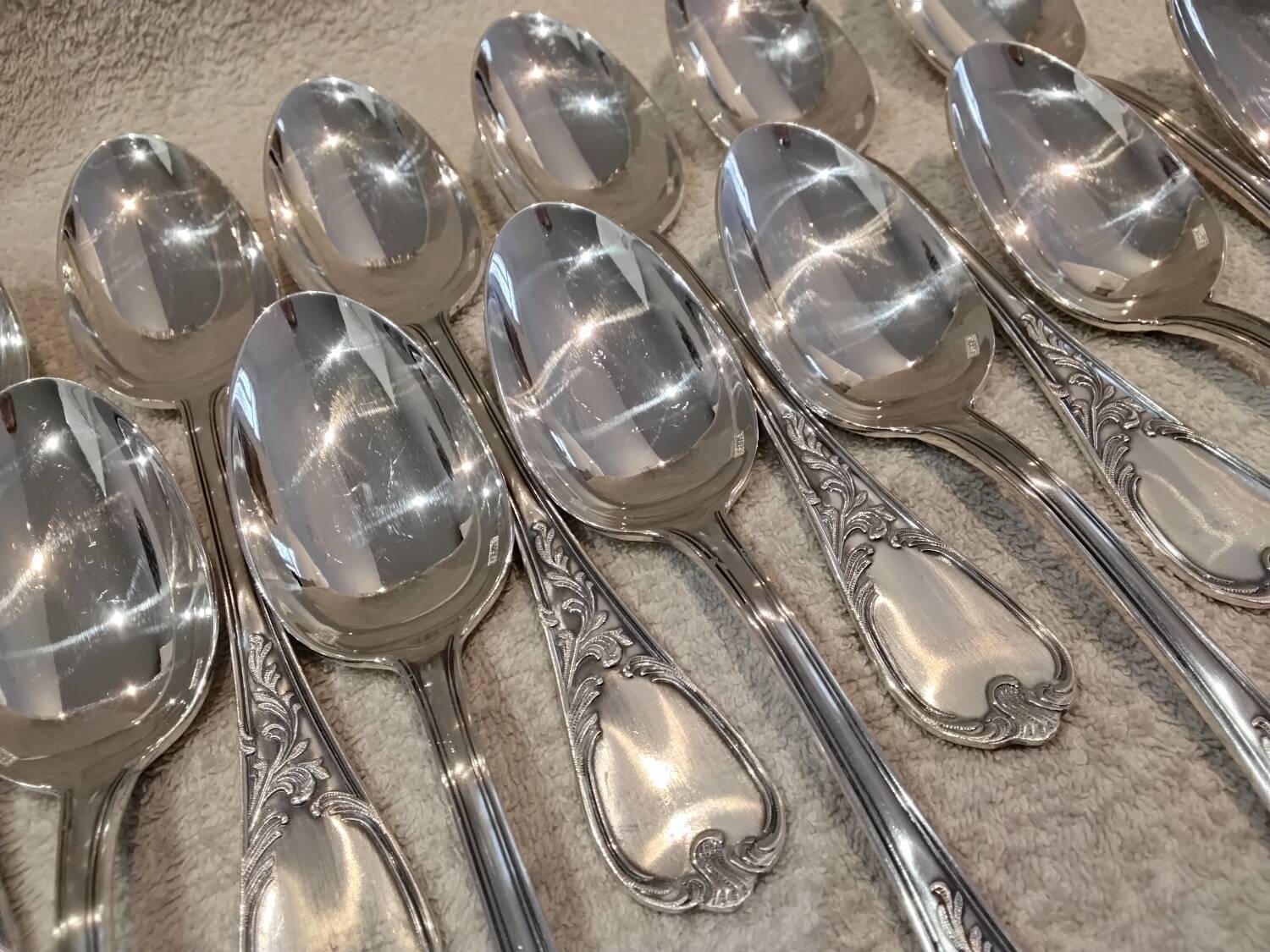 12 silver-plated metal soup spoons, Ercuis Dubarry model.