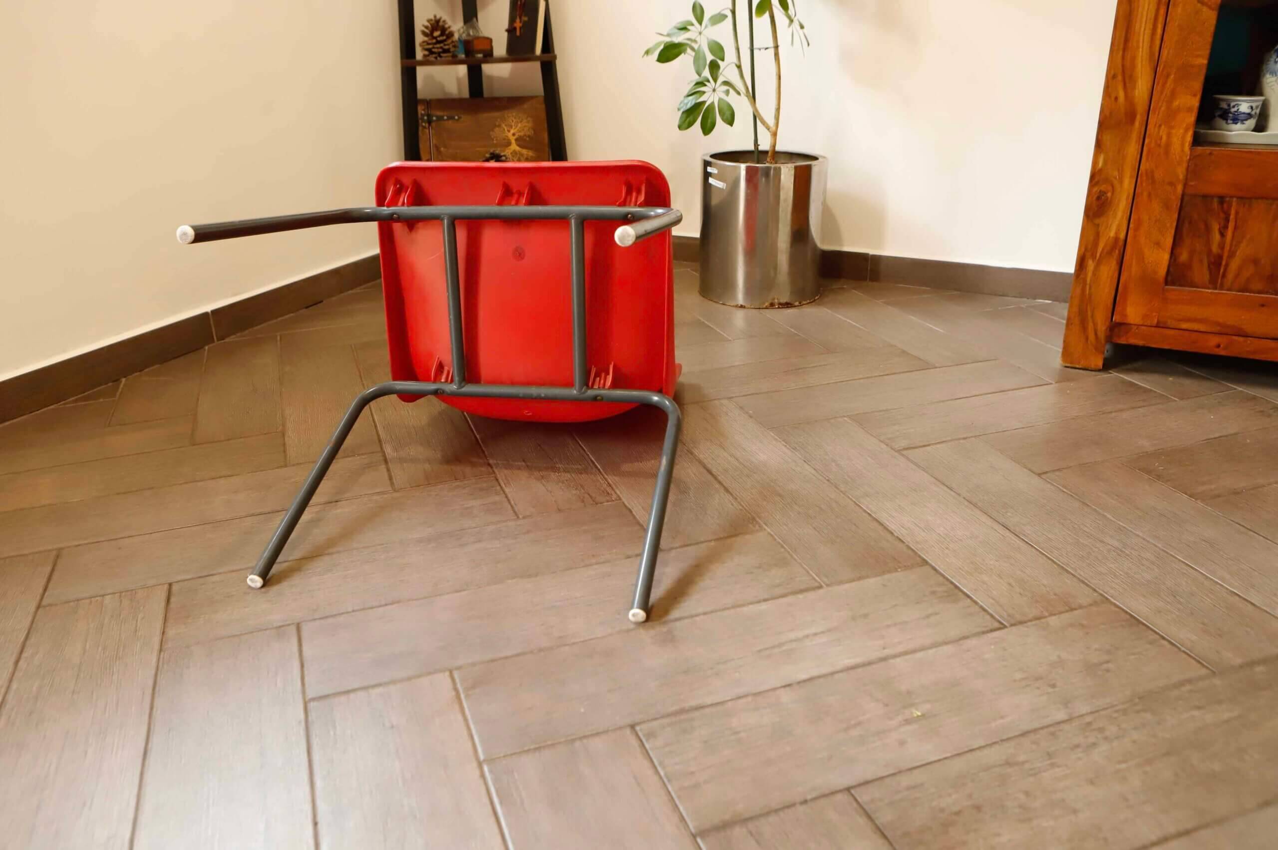 Pair of red plastic chairs with metal frame