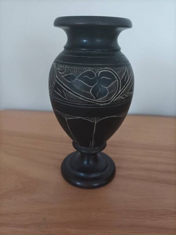 Black vase signed