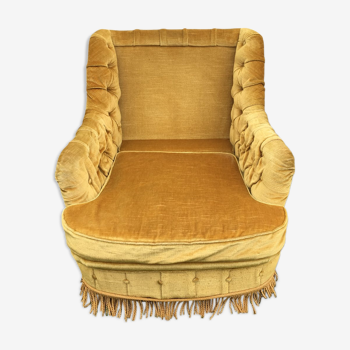 Fauteuil crapaud capitonné ocre