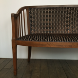 Old wooden and velvet bench