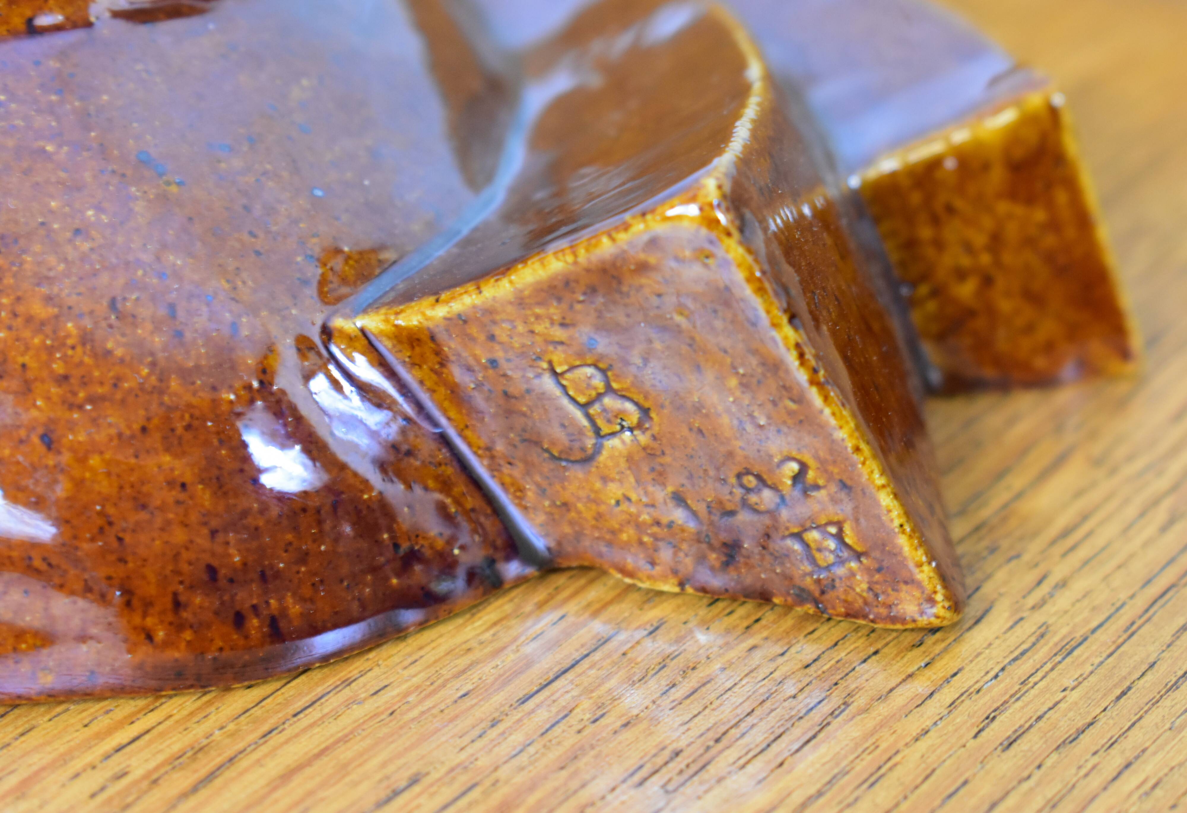 Signed brown enamel mask