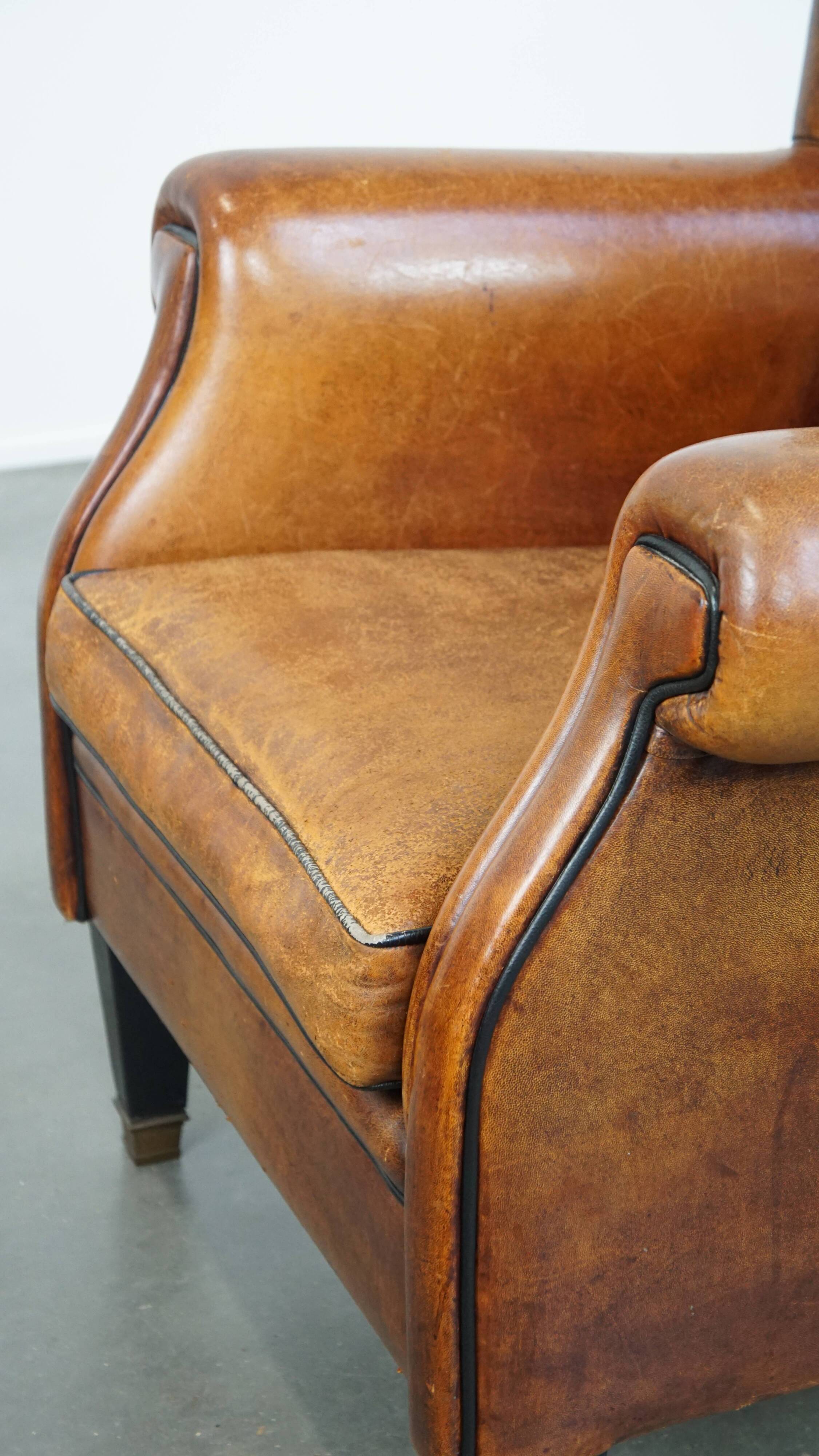 Fauteuil à oreilles en cuir de mouton vintage de style anglais