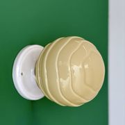 Vintage Art Deco globe wall light in pale yellow opaline.