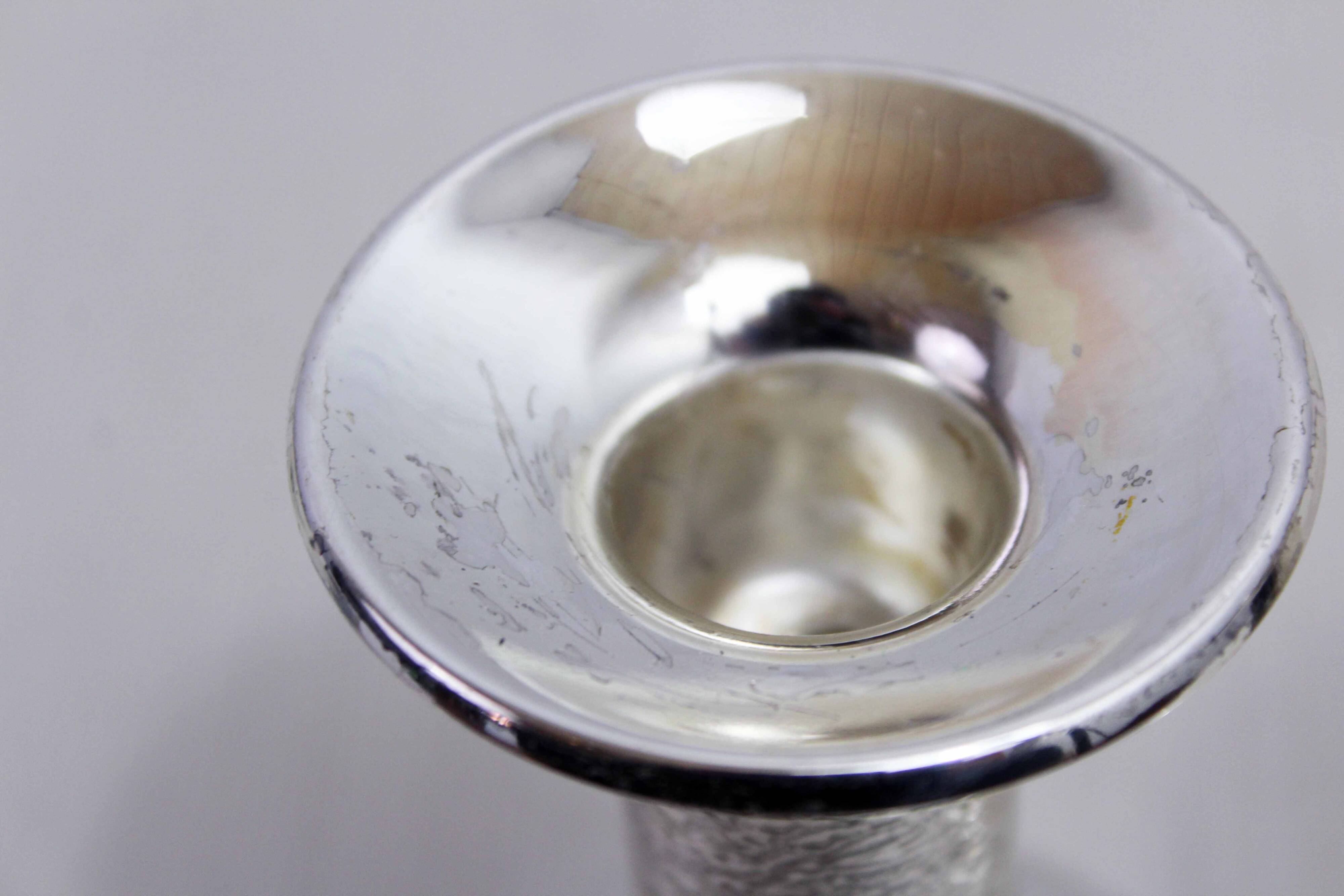 Pair of silver metal candlesticks