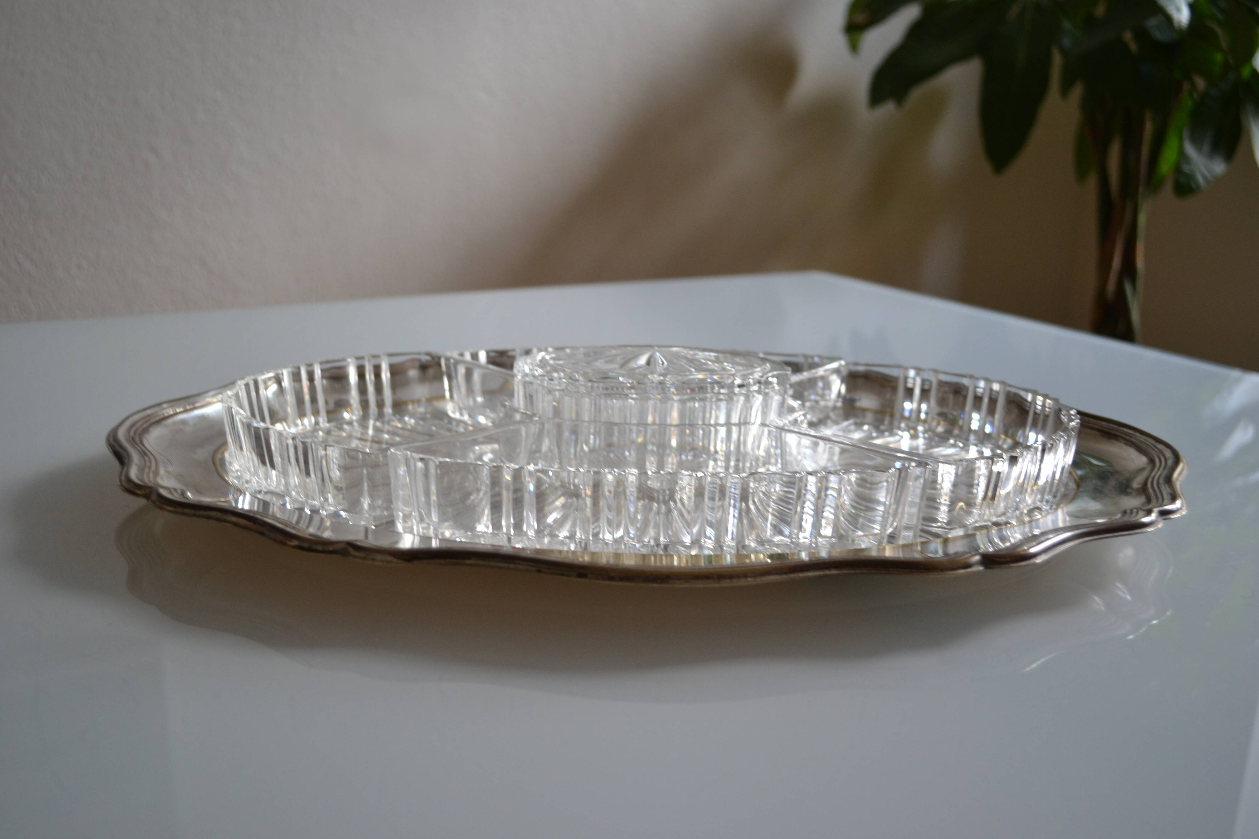 Silver-plated metal aperitif serving tray with HKE hallmark and glass.