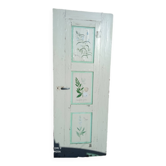 Old door painted with flower pattern