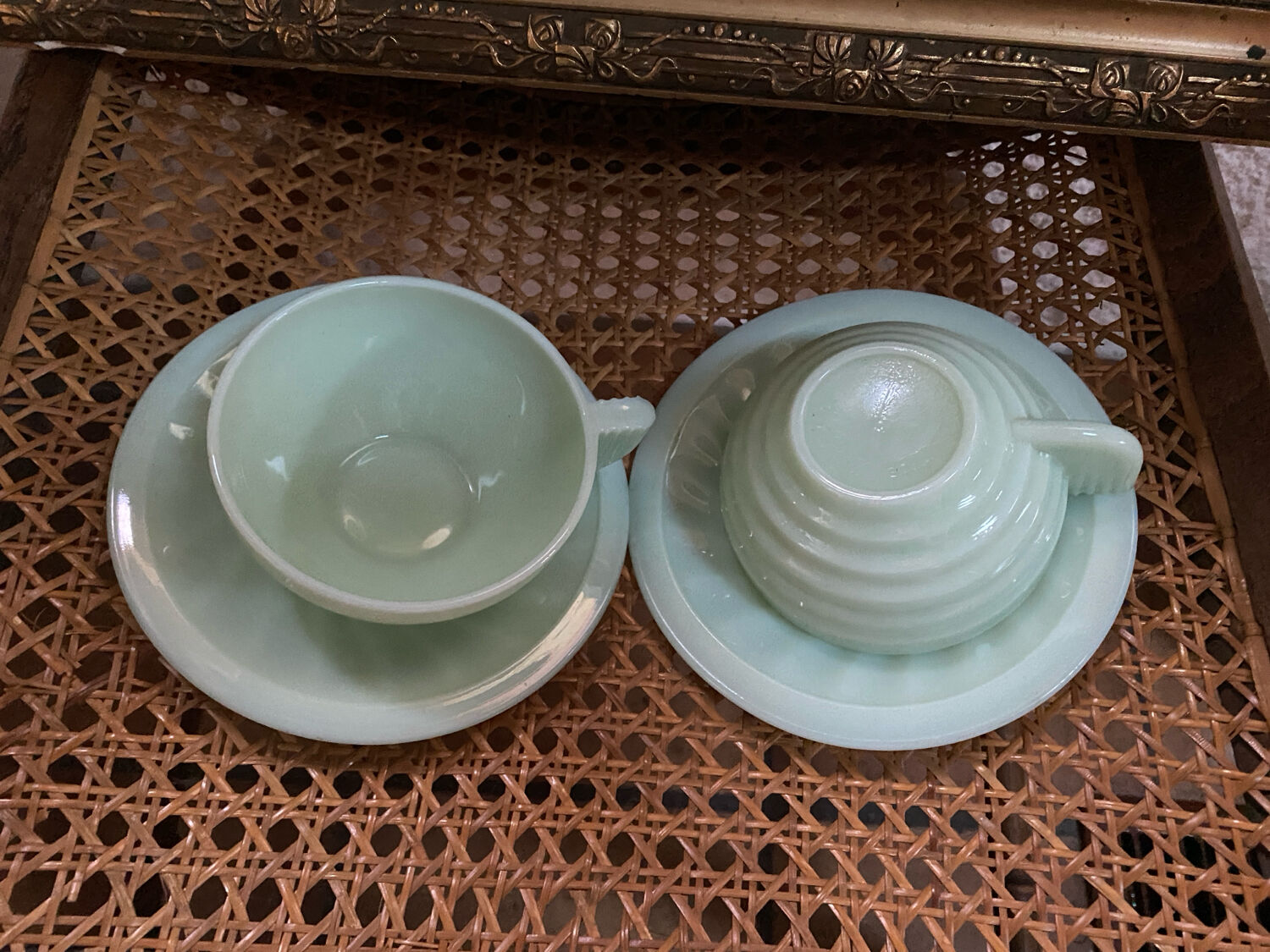 A pair of antique opaline tea cups.