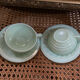 A pair of antique opaline tea cups.