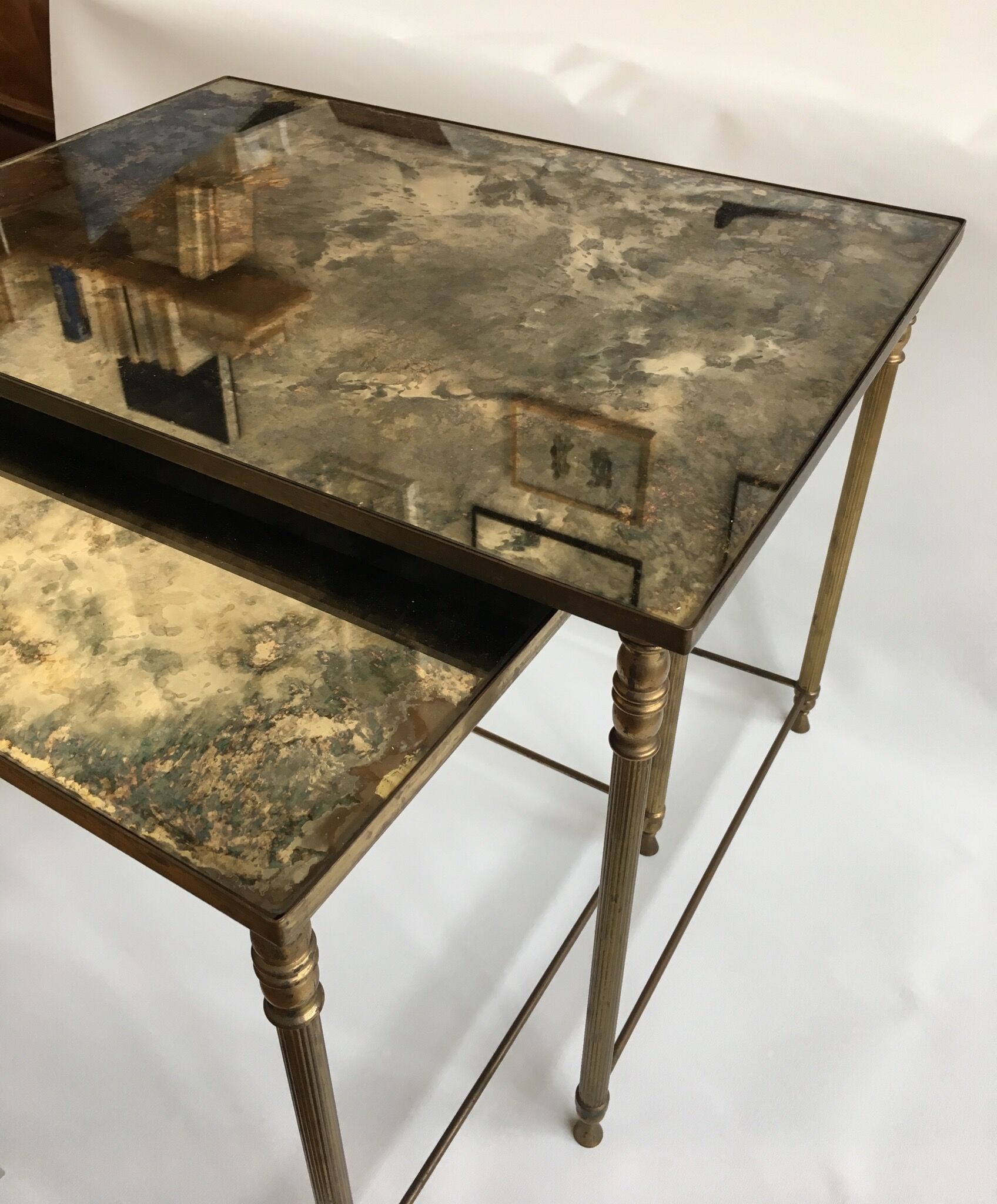 Brass and glass mirrored nesting tables