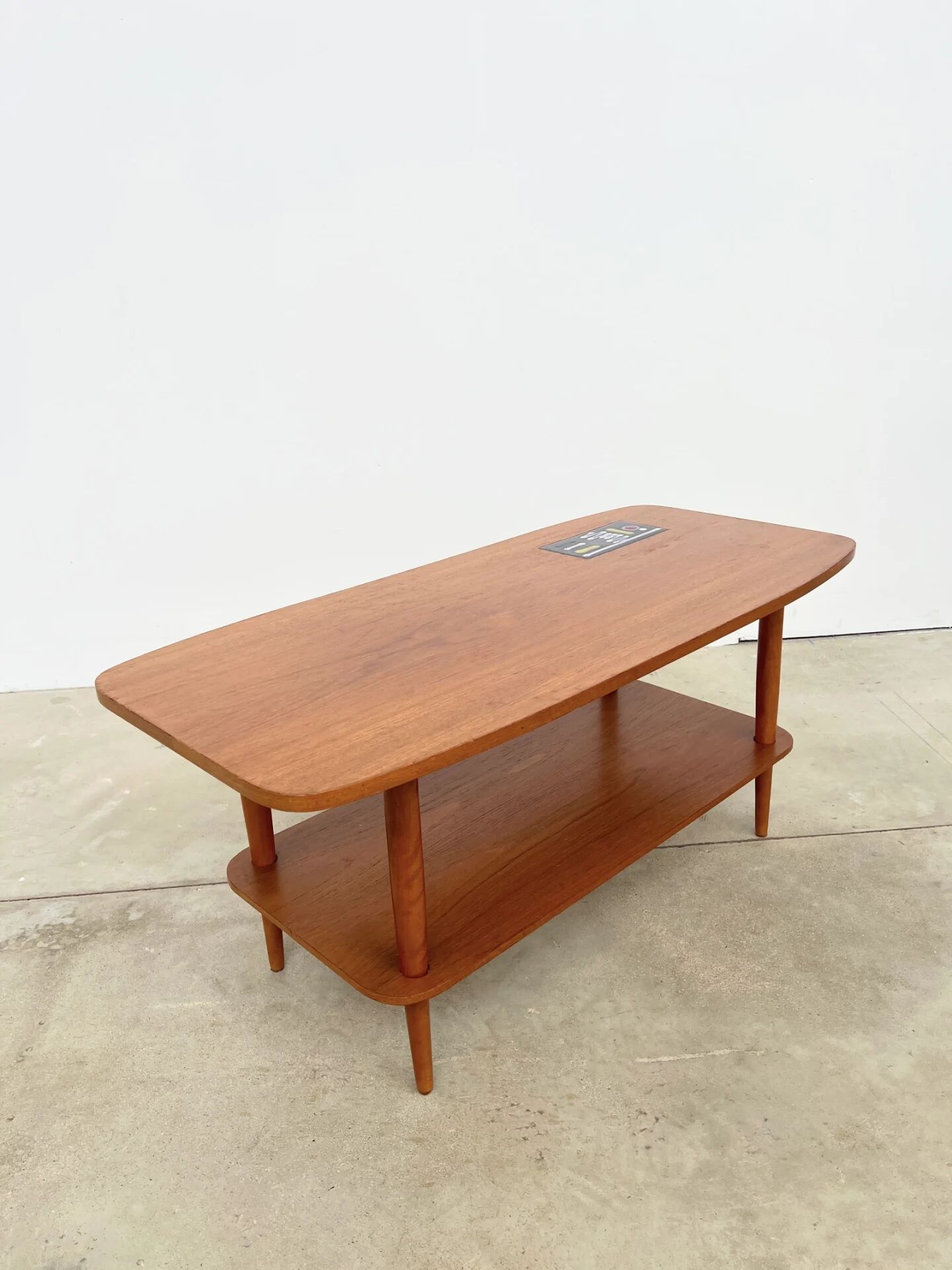 Teak coffee table with double top and ceramic insert — Scandinavian, 1960s