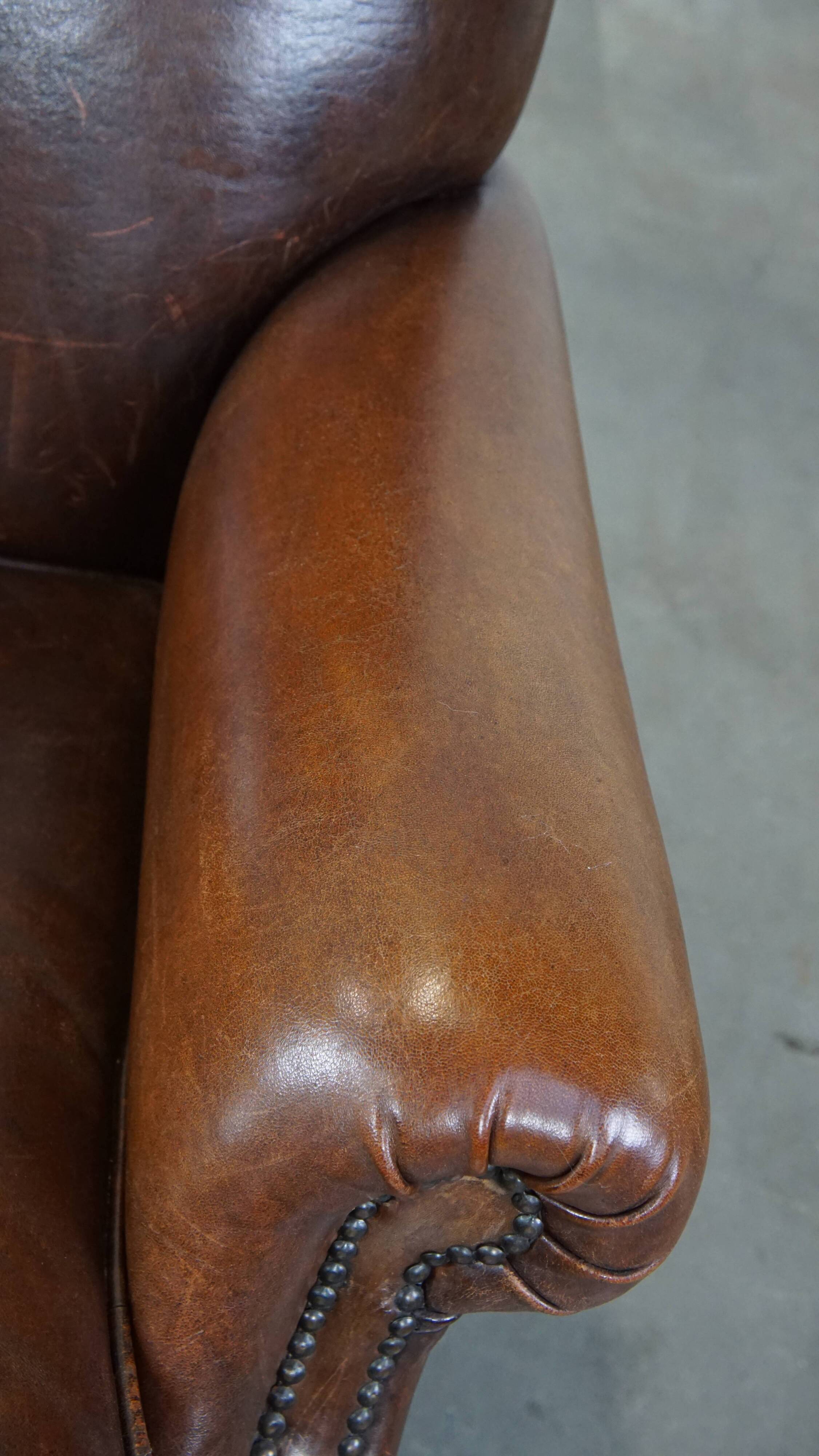 Sheep leather armchair on wheels