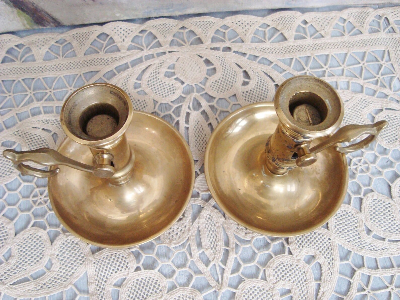 Pair of brass cellar rat candlesticks