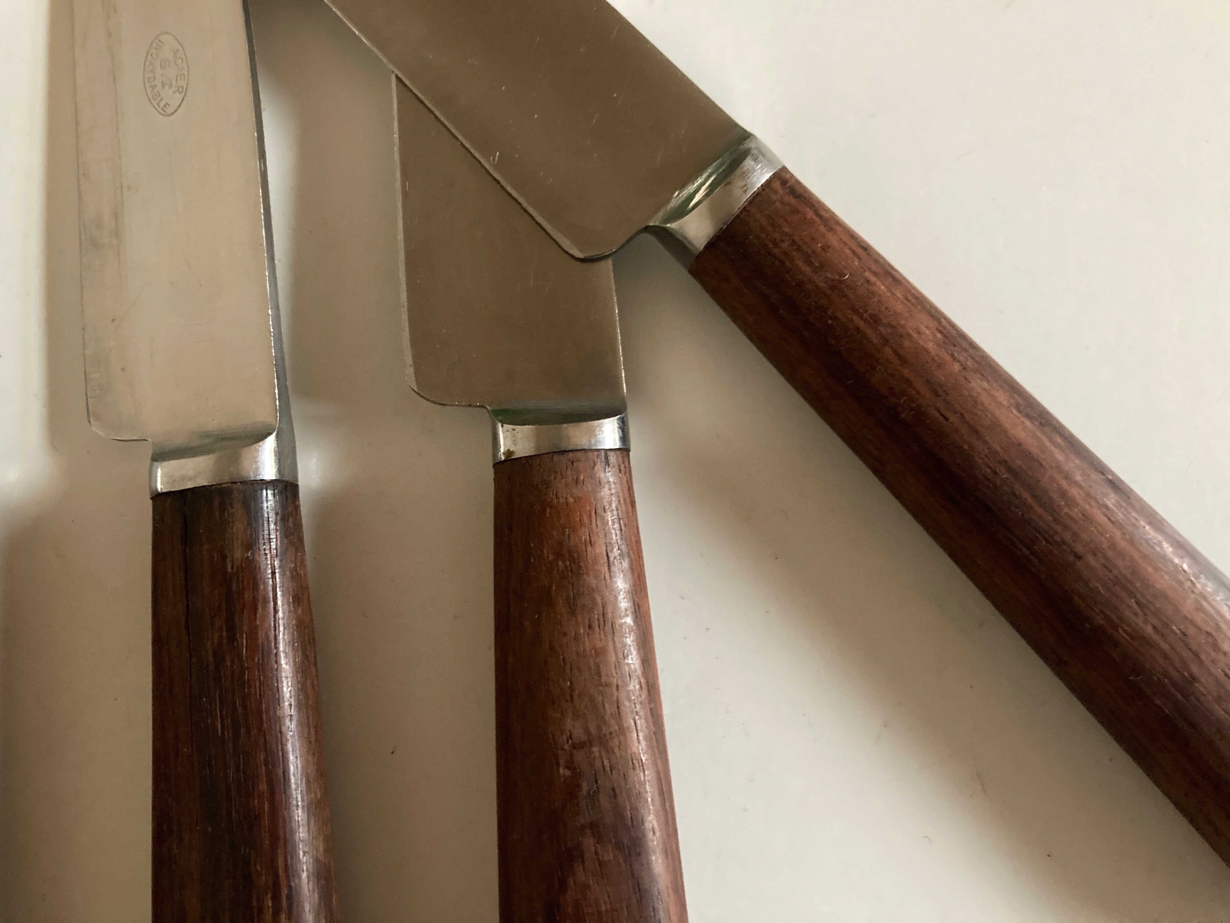 Set of 9 knives with mid century rosewood handle