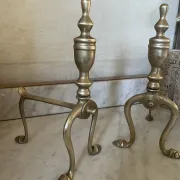 Pair of Victorian brass fire dogs from the late 19th century.