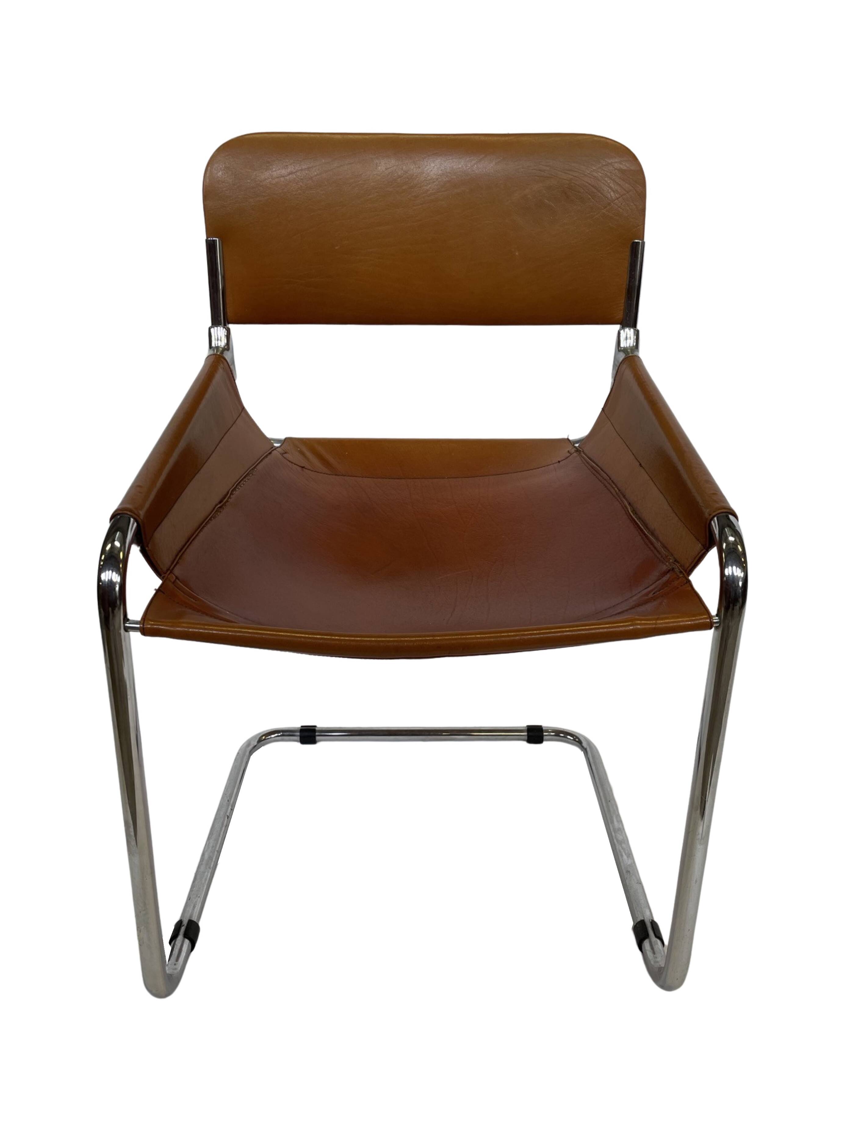 vintage dining room chair in cognac leather and chrome 1970s Italy